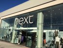 Warm weather boosts sales at Next Image